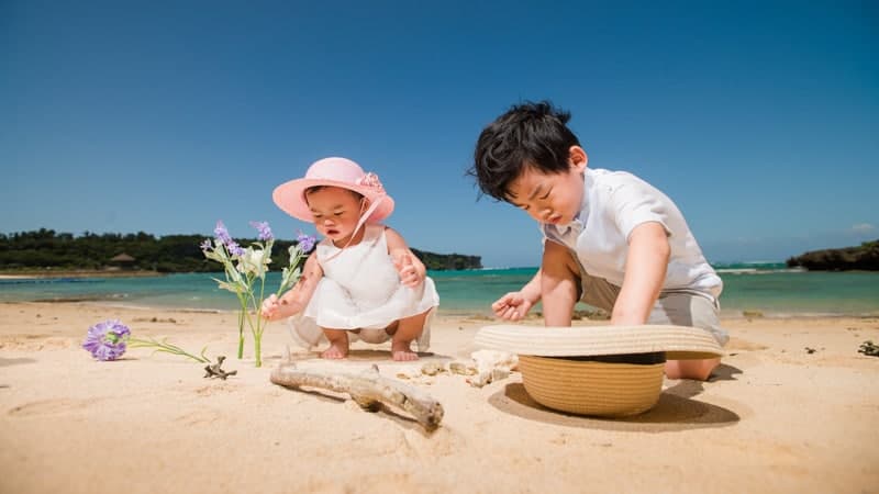 Baby and toddler playing on beach - Most Baby and Toddler Friendly Cruises