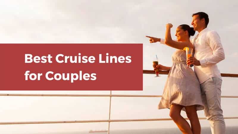 Man and woman looking out over the railing on a cruise ship.