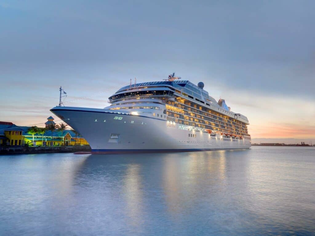 Cruise ship in the ocean at sunset.