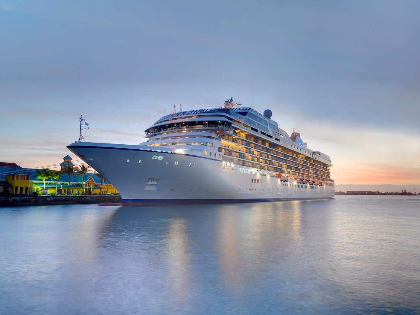 Cruise ship in the ocean at sunset.