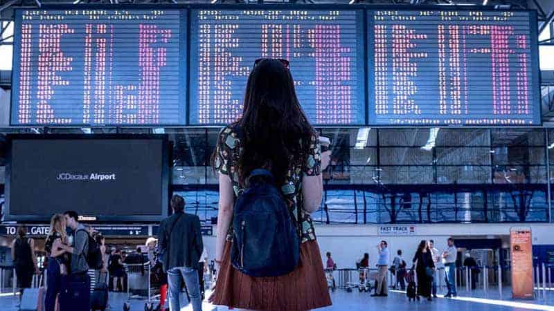 woman standing in airport.