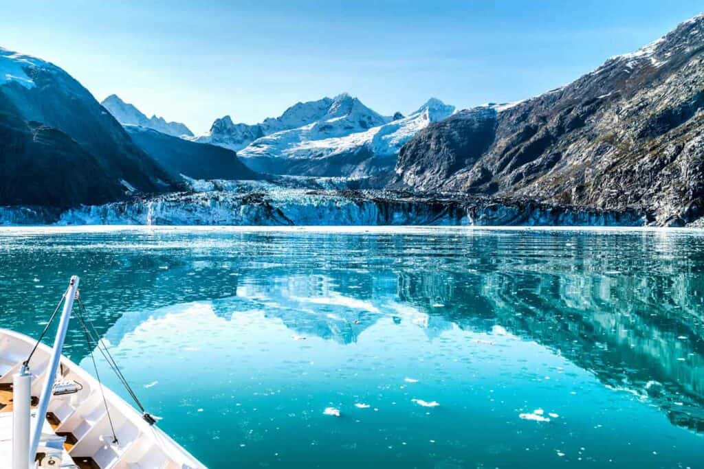 Cruise ship cruising towards glacier in Alaska.