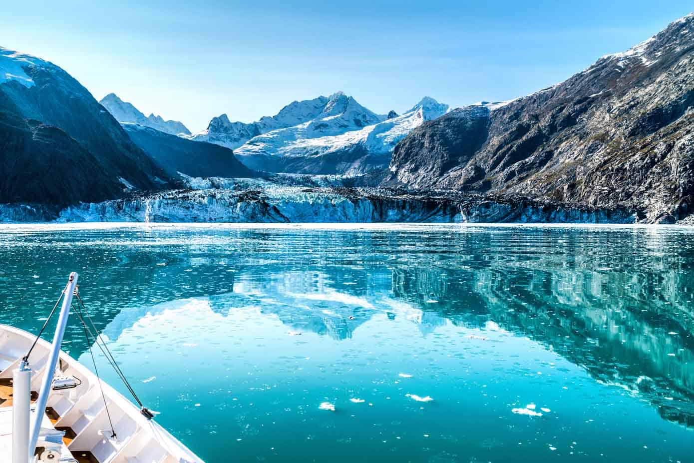 3 Fascinating Celebrity Alaska Cruises Cruise ship cruising towards glacier in Alaska.