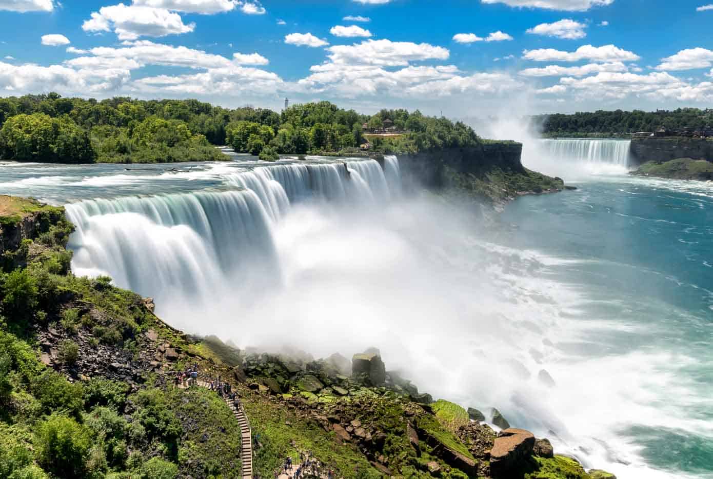 Niagara falls waterfalls with huge water mist cloud at the bottom.