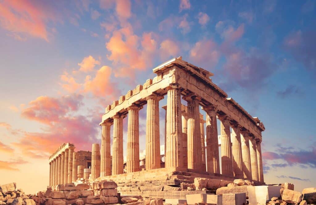 Ancient Parthenon on the Acropolis in Athens, Greece at sunset.