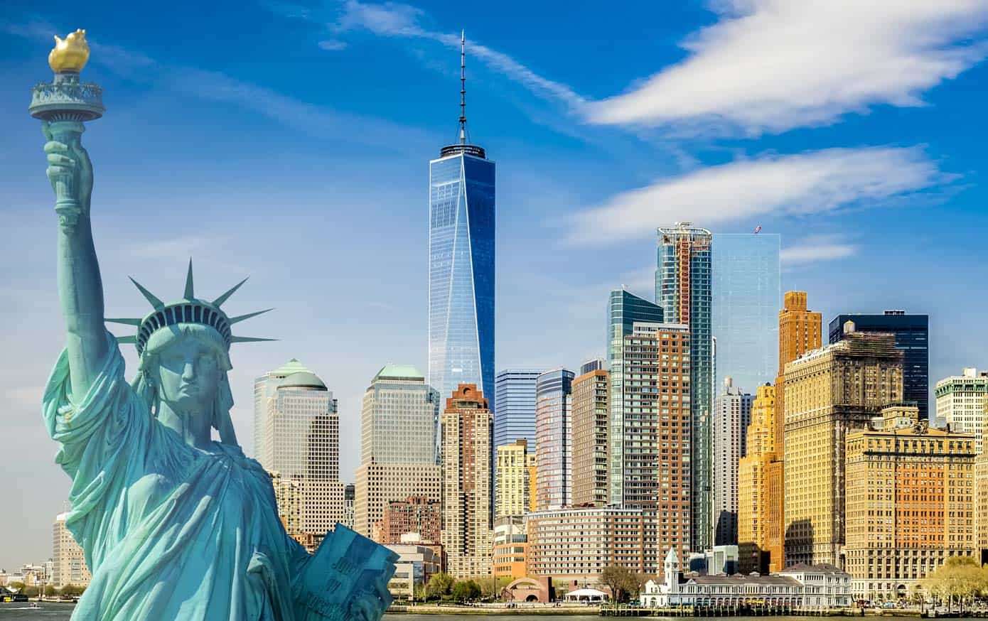 The New York City skyline with the Statue of Liberty in front of the World Trade Center.