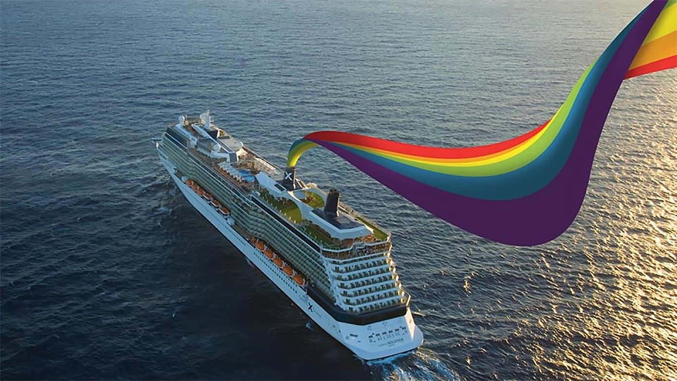 Celebrity cruise ship with rainbow flag coming out of the back.