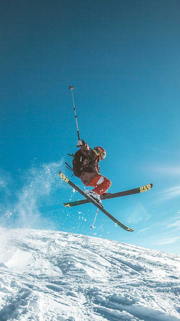 snowboarder-flying-off-jump Skier jumping through the air.